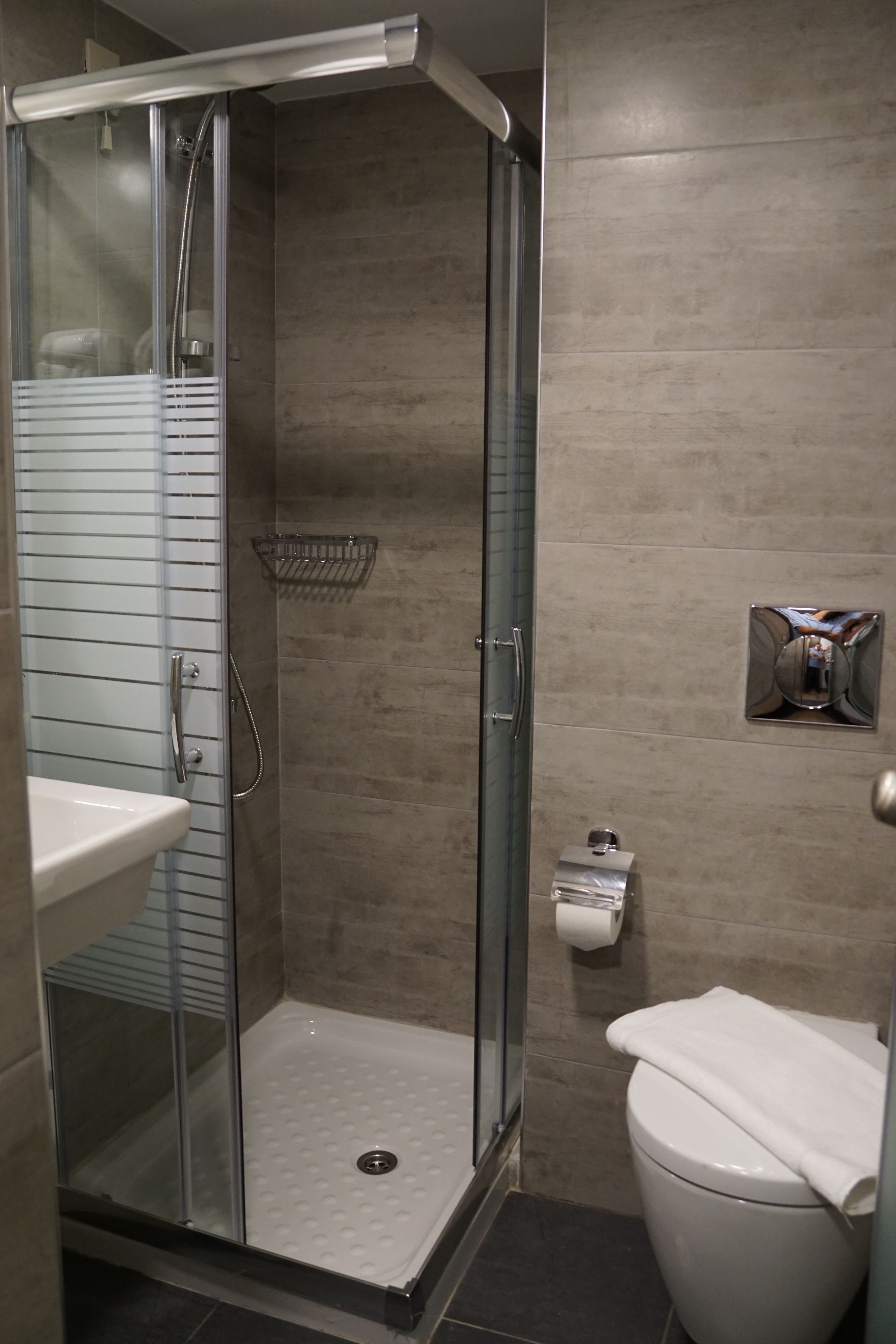 economy double room | bathroom | shower, free toiletries, hair dryer, slippers