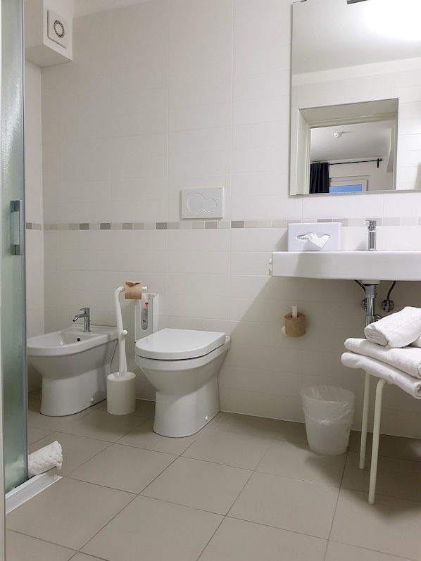 Shower, rainfall showerhead, designer toiletries, hair dryer