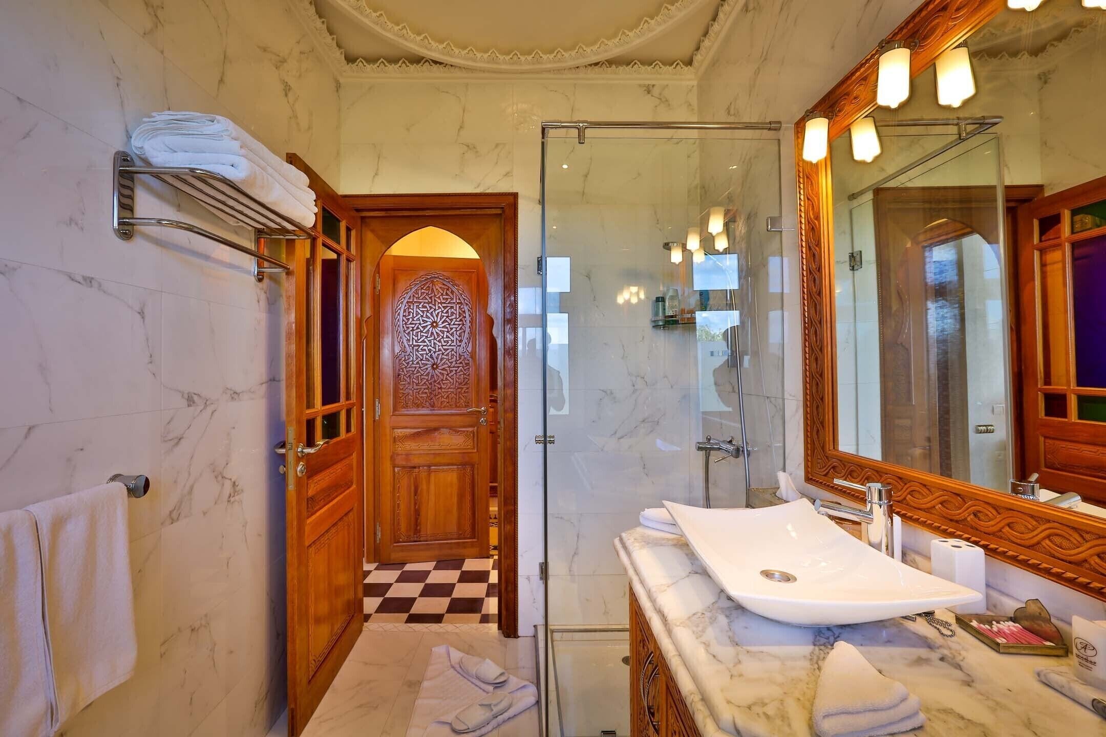 junior suite | bathroom | shower, free toiletries, hair dryer, bathrobes