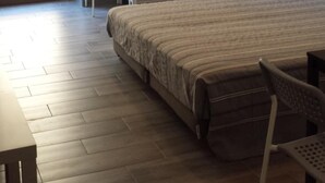 A bedroom with a bed, a wardrobe, a chair, and a desk. - Beda Ragusa (Ragusa)