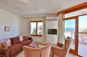Comfort Apartment, 2 Bedrooms, Balcony, Partial Sea View | Living area | Flat-screen TV