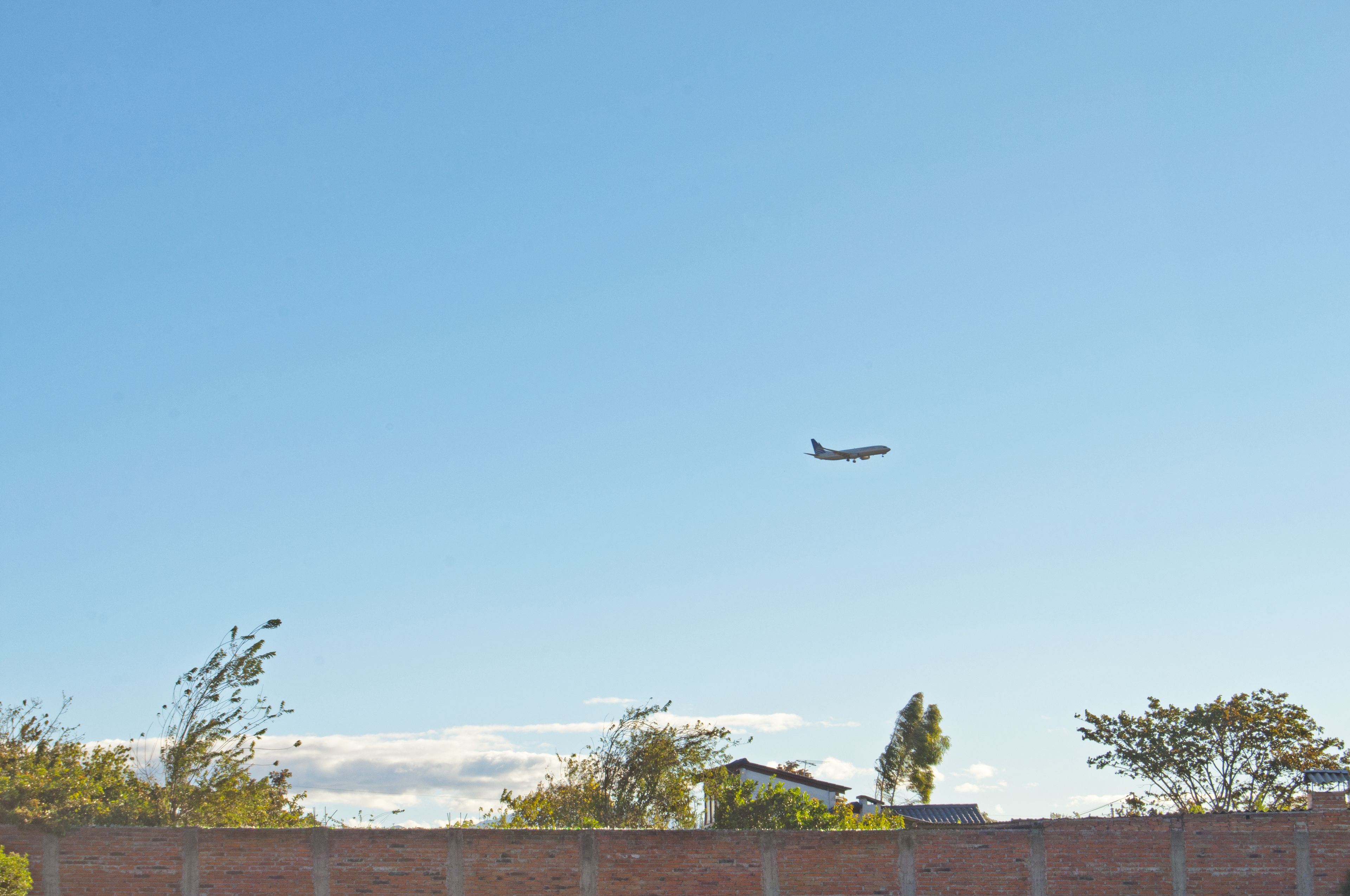 An airplane flying in a clear sky.