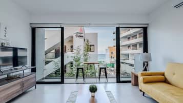 Apartment, 2 Bedrooms, Pool View | Living area | 34-inch flat-screen TV with cable channels, TV