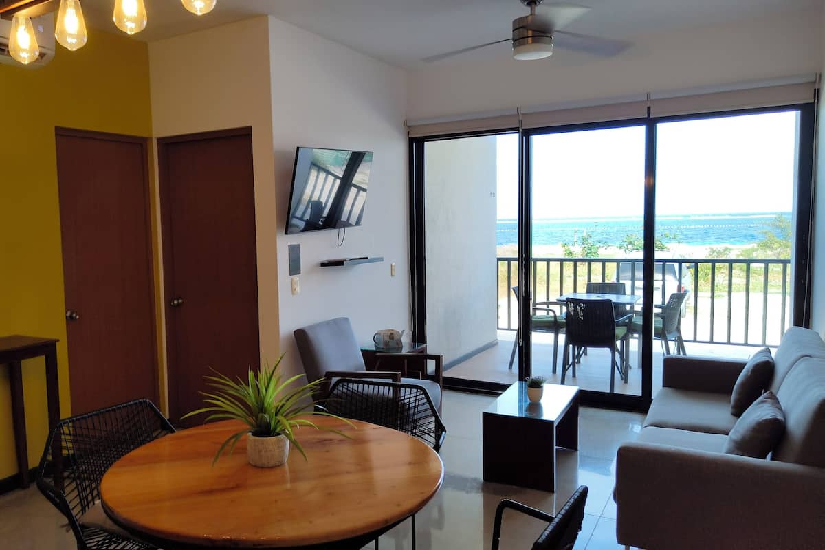 Apartment, 2 Bedrooms, Ocean View | Living area | 34-inch flat-screen TV with cable channels, TV