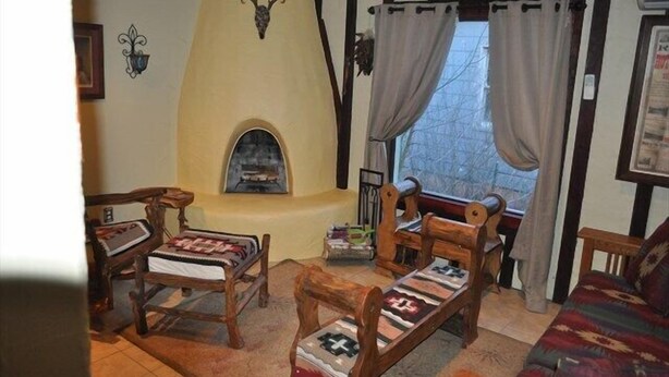 Signature Cottage, 2 Bedrooms, Non Smoking, Hot Tub | Living room | Flat-screen TV, fireplace, DVD player - Rosita'a Bungalow (Hot Springs)