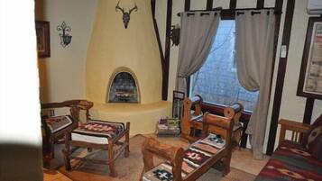 Signature Cottage, 2 Bedrooms, Non Smoking, Hot Tub | Living room | Flat-screen TV, fireplace, DVD player