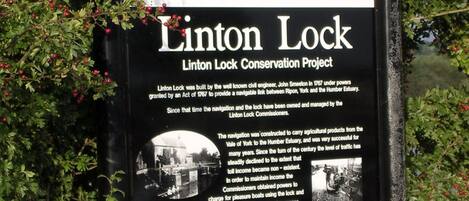 A signboard for the Linton Lock Conservation Project by British Waterways, detailing its history and significance.