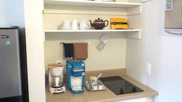 Fridge, microwave, coffee/tea maker, cookware/dishes/utensils