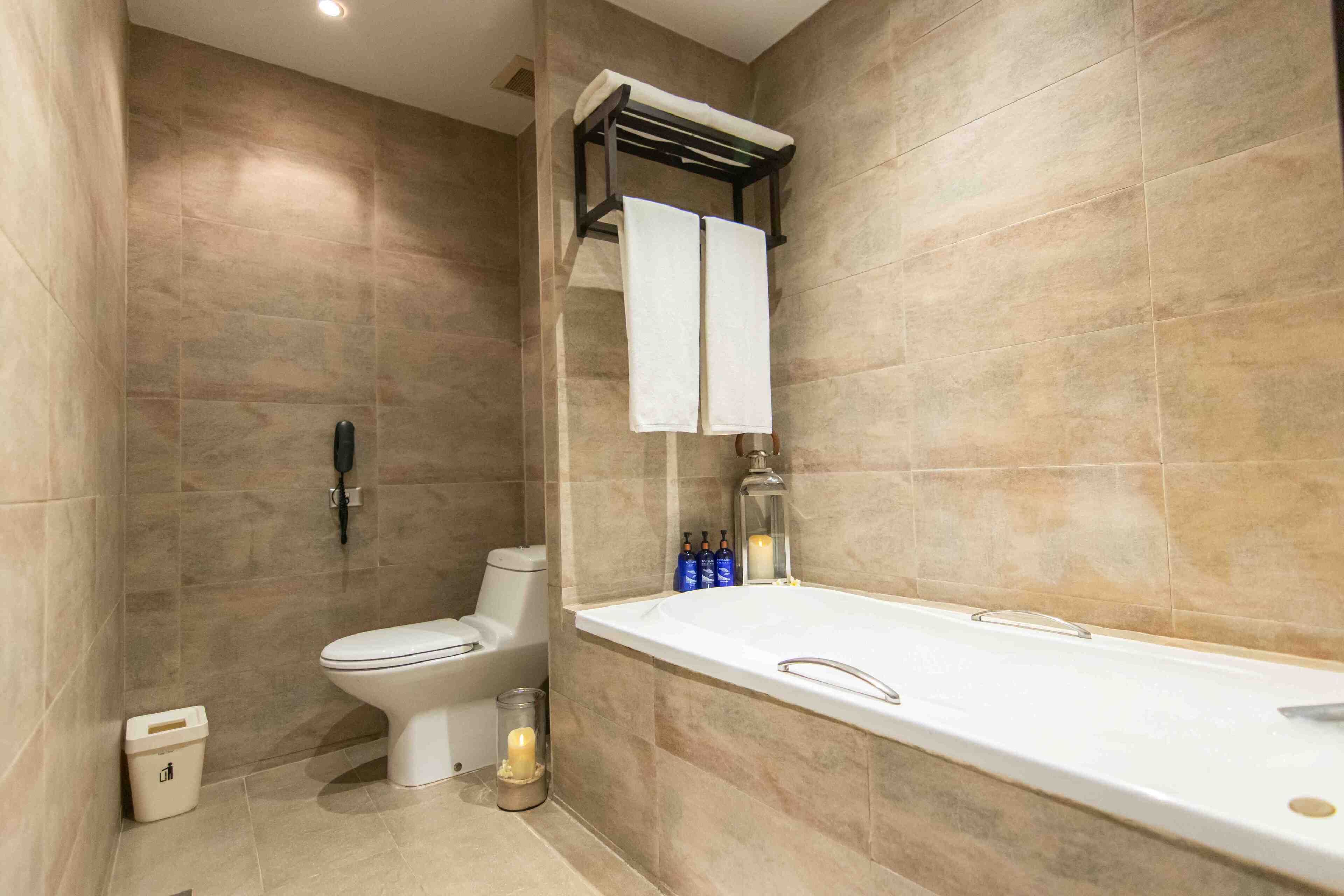 premium double room, 1 king bed | bathroom | shower, rainfall showerhead, eco-friendly toiletries, hair dryer