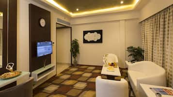 Club Suite, 1 Double Bed, Smoking, Lake View | Living room | Flat-screen TV