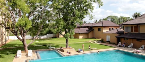 Outdoor pool, open 7:00 AM to 7:00 PM, pool umbrellas, pool loungers