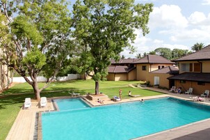 Outdoor pool, open 7:00 AM to 7:00 PM, pool umbrellas, sun loungers