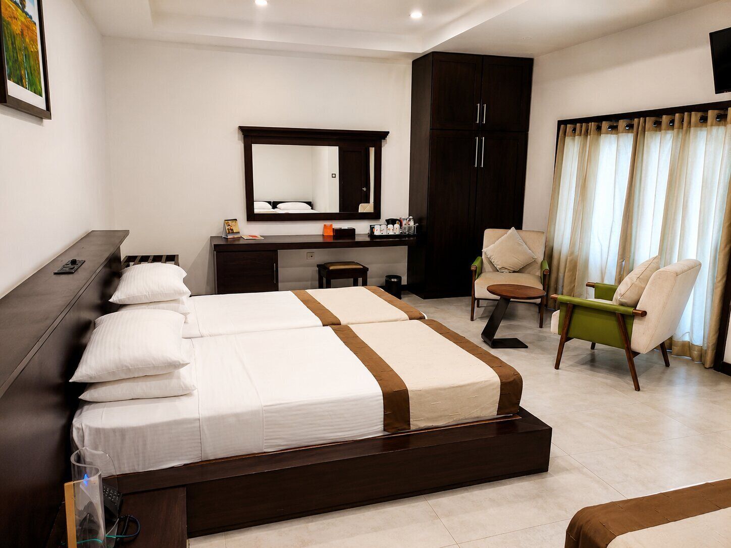 Deluxe Quadruple Room | Premium bedding, in-room safe, desk, blackout drapes