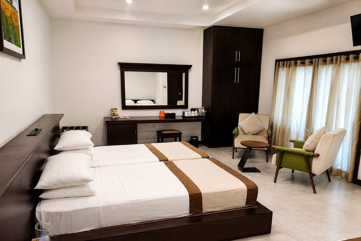 Deluxe Quadruple Room | Premium bedding, in-room safe, desk, blackout drapes
