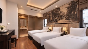 A hotel room with two beds, a desk, and a large window. - Ja Cosmo Premier Hotel (Hanoi)
