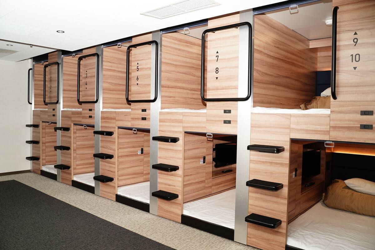 A row of bunk beds with individual numbers on each bed, indicating private sleeping areas.