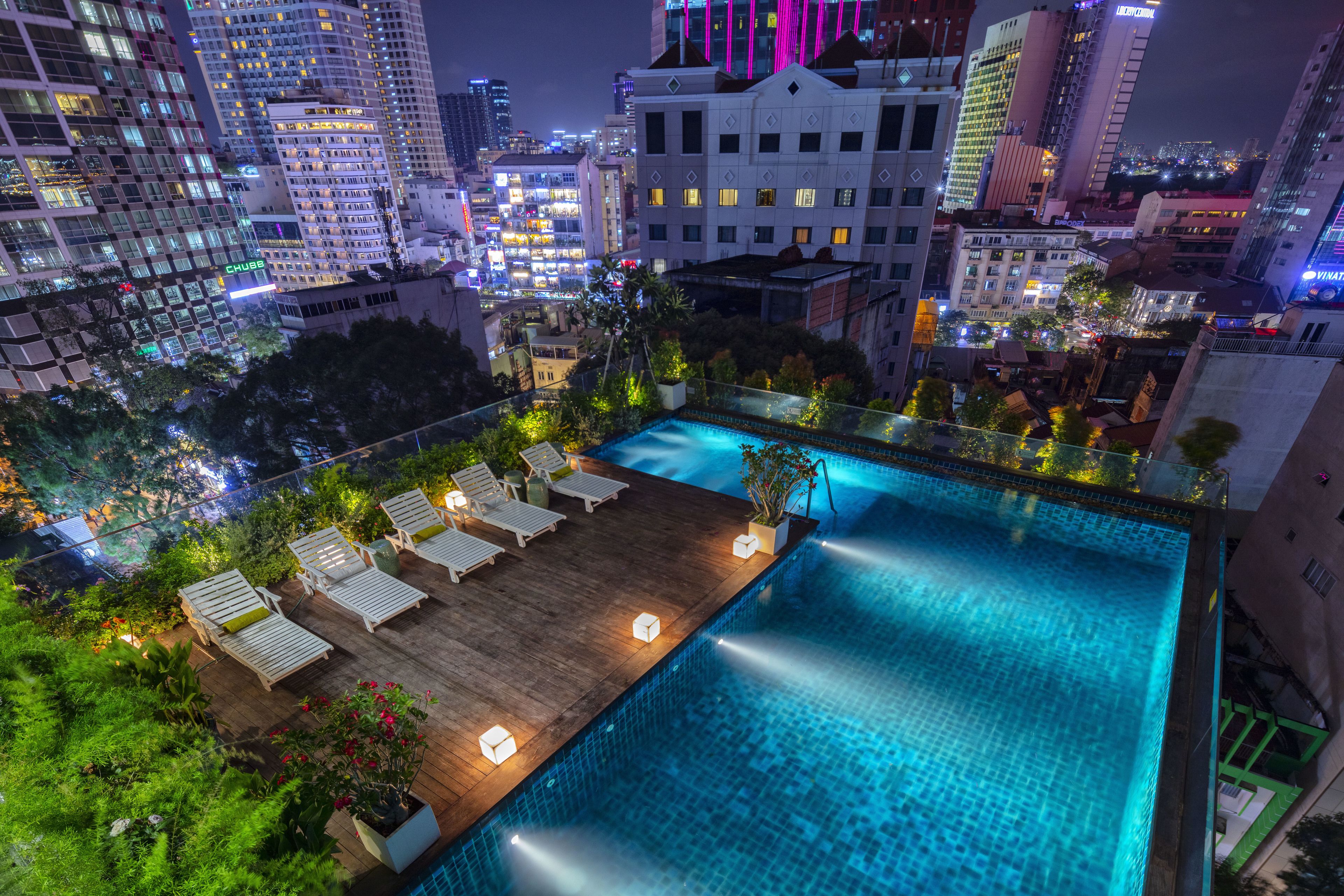 outdoor pool, open 6:00 am to 11:00 pm, pool umbrellas, pool loungers