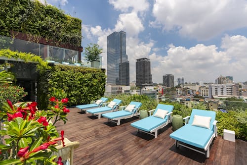 Outdoor pool, open 6:00 AM to 11:00 PM, pool umbrellas, pool loungers