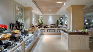 A buffet setup with various food items and serving utensils. - Au Lac Charner Hotel (Ho Chi Minh City)