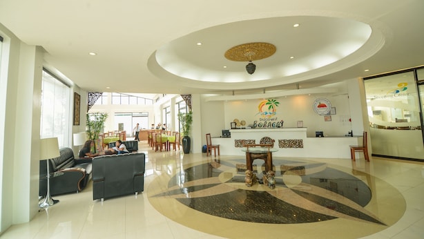 A spacious lobby with a reception desk, seating area, and a large decorative ceiling. - Discover Boracay Hotel and Spa (Kalibo)