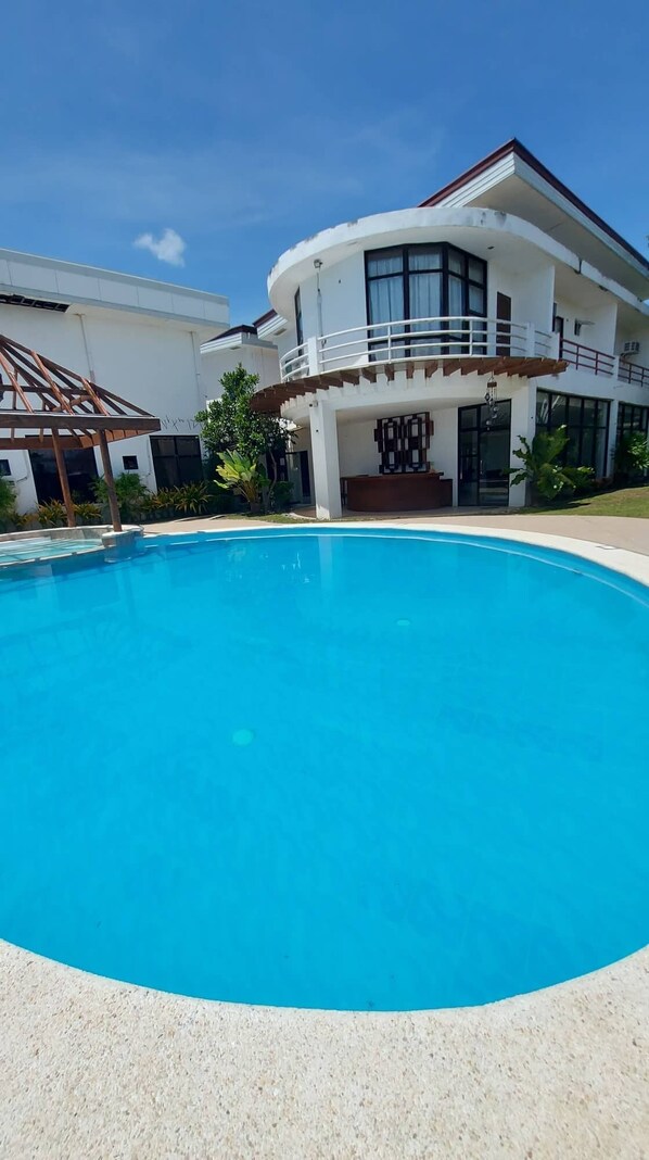 Outdoor pool, pool umbrellas, pool loungers