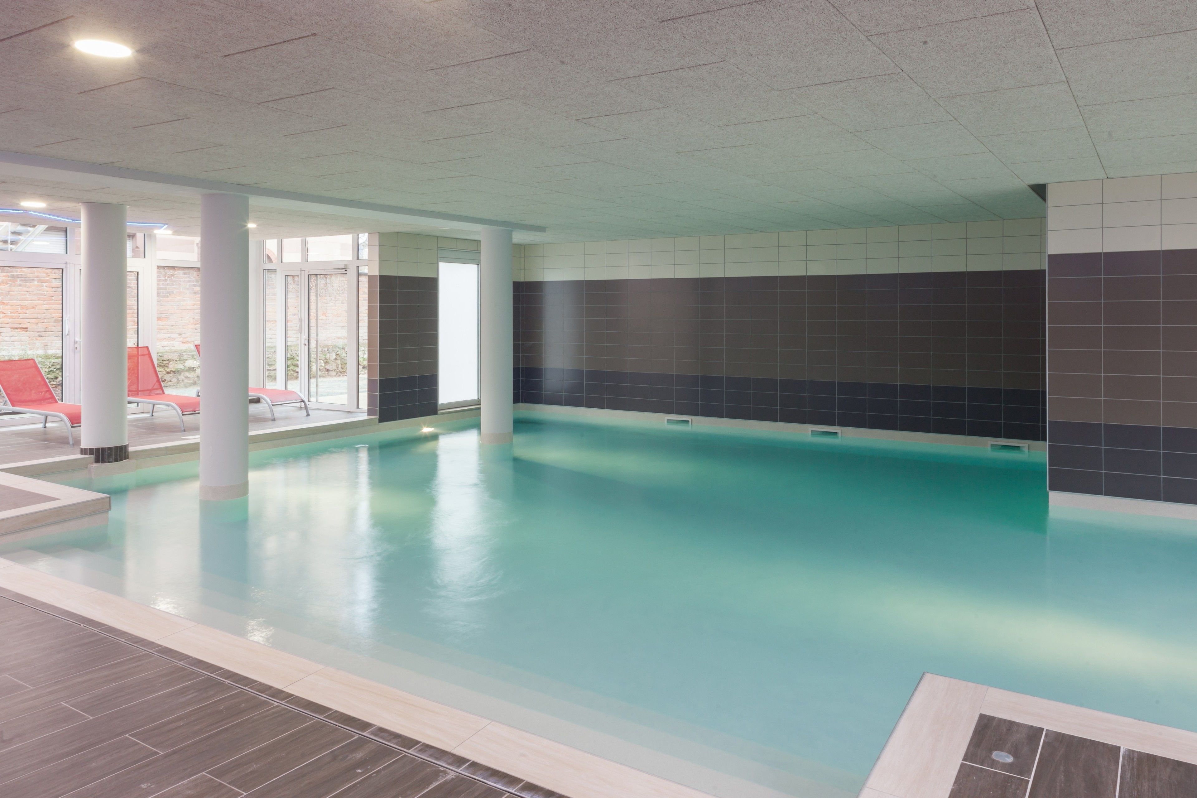 Indoor pool, open 9:00 AM to 7:00 PM, pool loungers