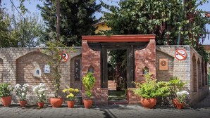 A brick entrance with a sign reading "SPA" and a no-smoking sign. - Shaligram Hotel (Lalitpur)