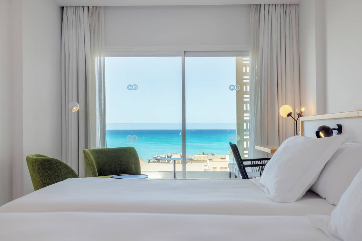 double room, balcony, partial sea view | in-room safe, desk, blackout curtains, iron/ironing board