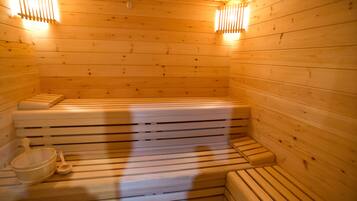 A wooden sauna with benches and a bench seat, a wooden bench, and a wooden bench seat.