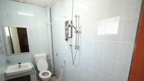A bathroom with a toilet, sink, and shower. - Hotel Lotte (Ipoh)