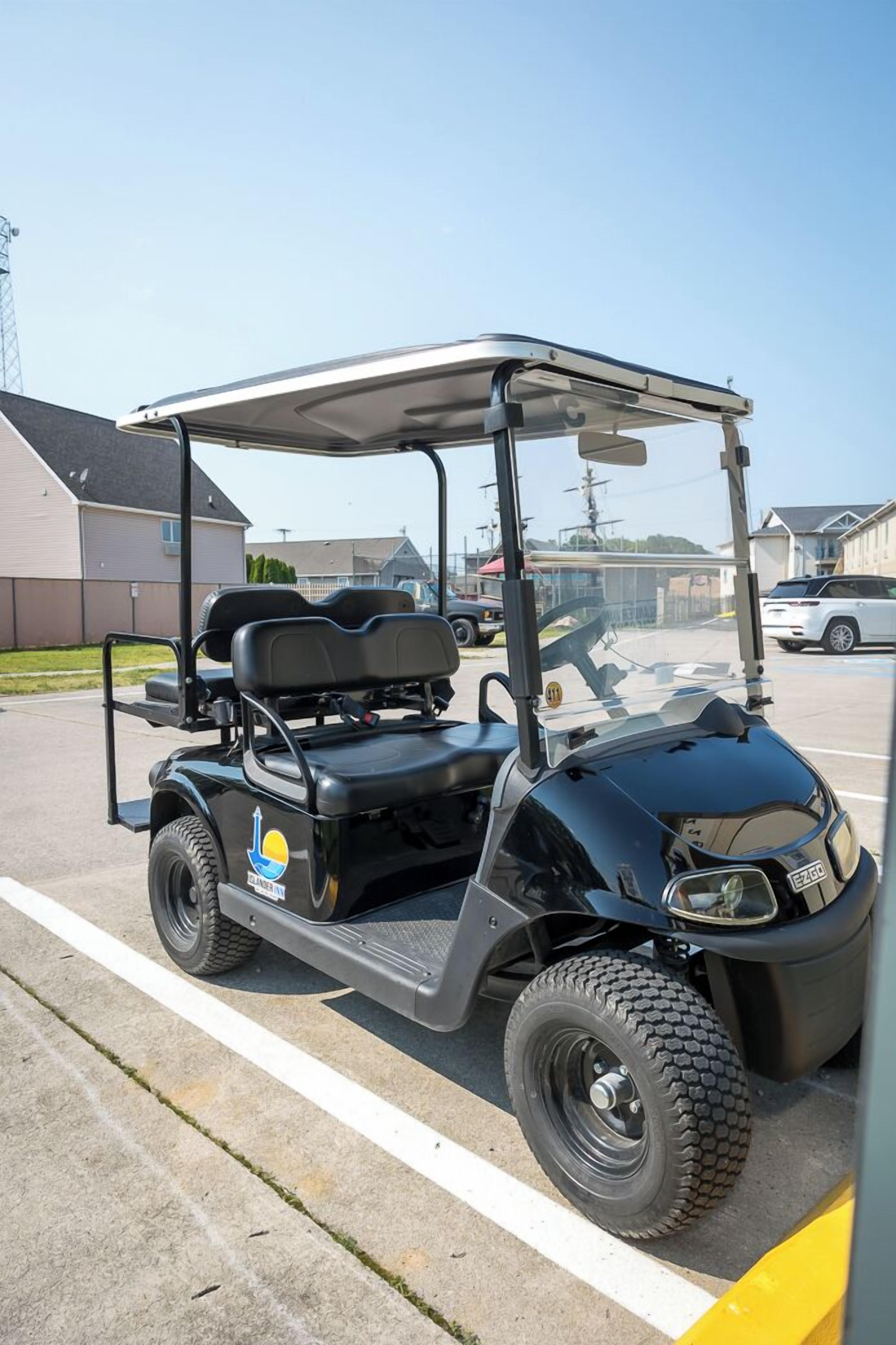 A golf cart parked in a parking lot.