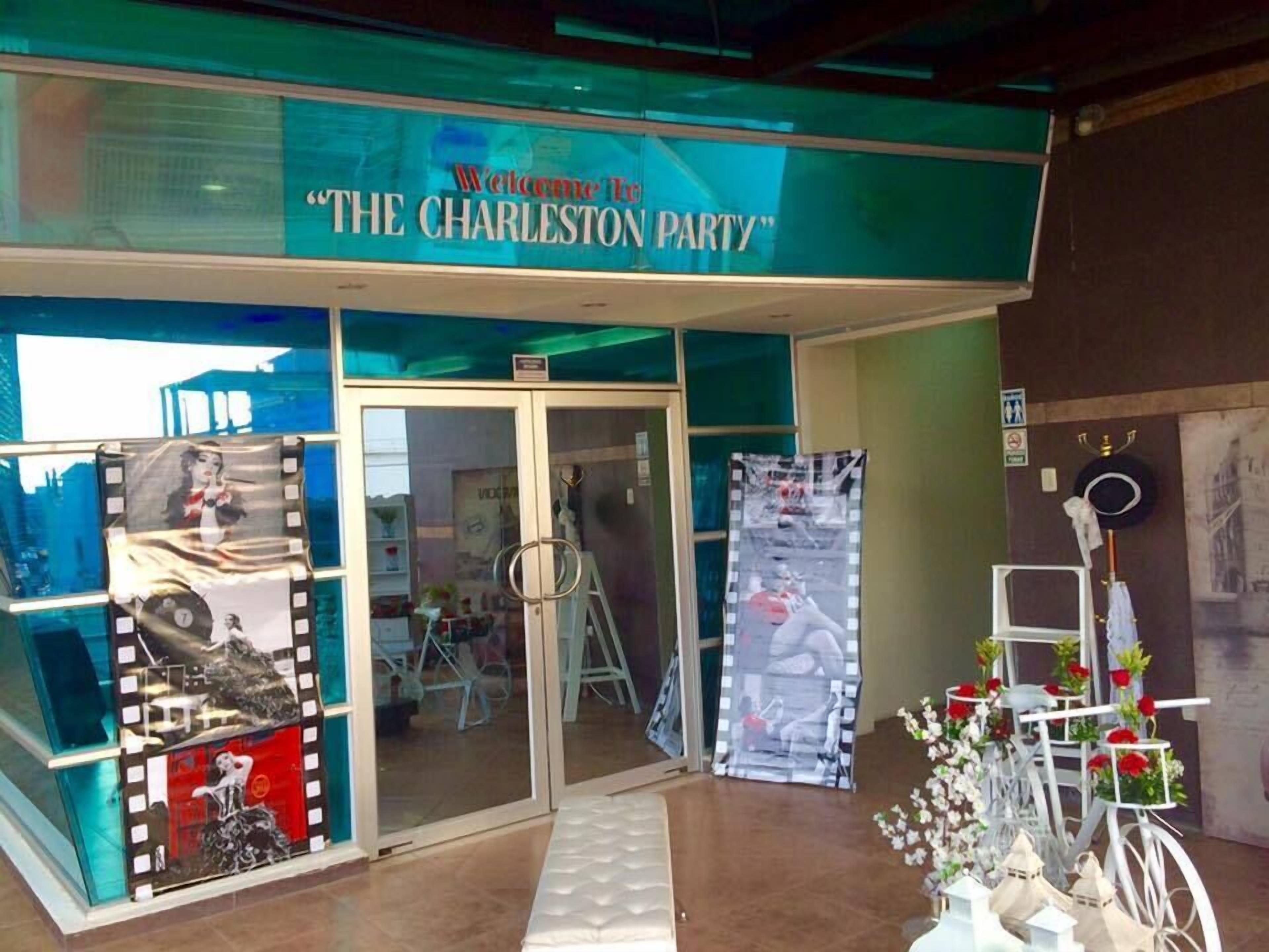 A storefront with a sign reading "Welcome to The Charleston Party".
