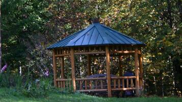 Situated in a lush landscape, this gazebo offers a serene escape.