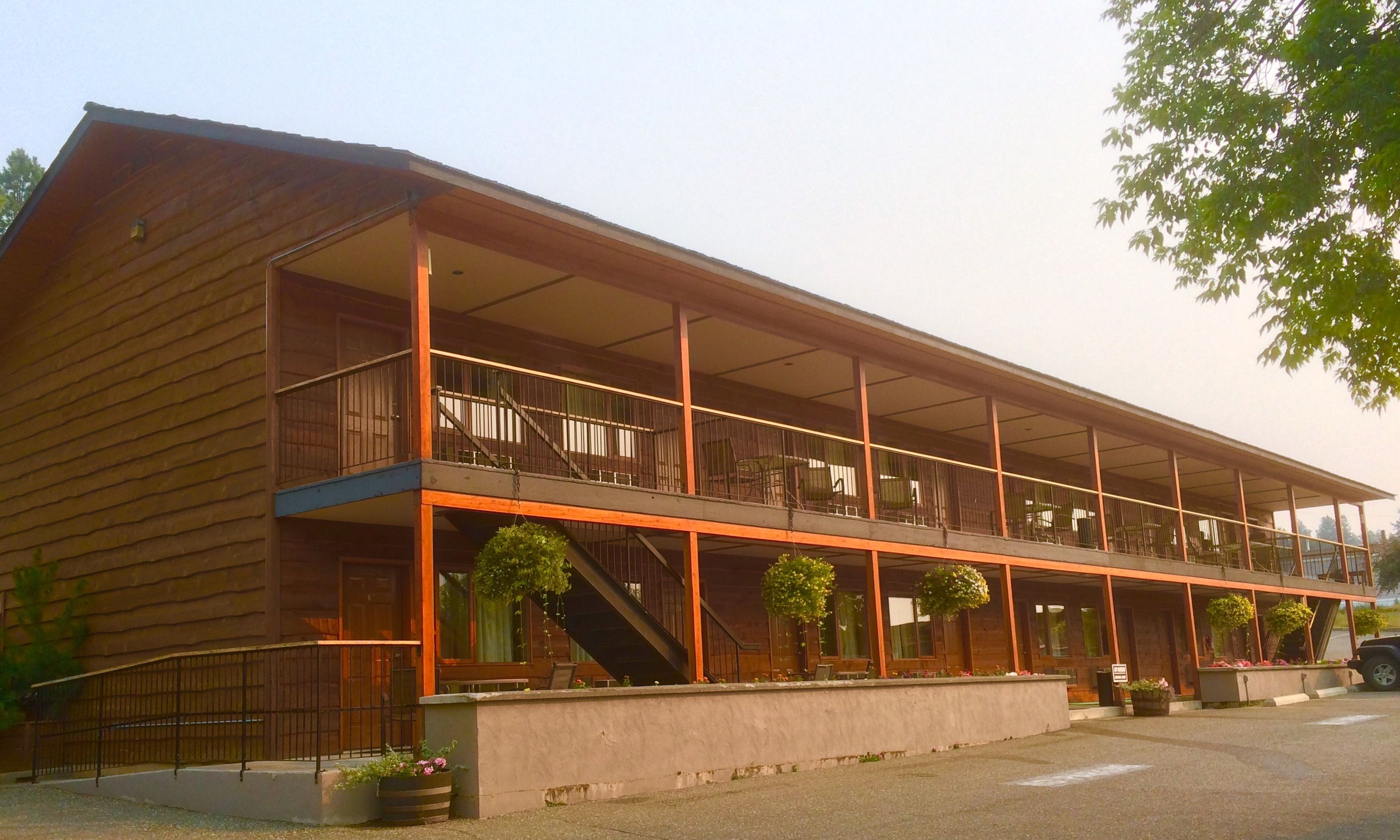 A two-story building with a balcony on the upper floor.