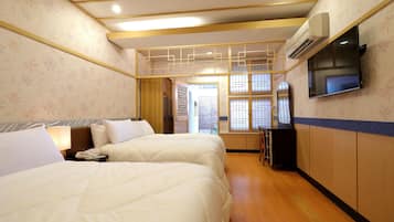 Standard Quadruple Room, 2 Double Beds | Individually decorated, blackout drapes, free WiFi, bed sheets