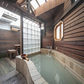 Deluxe Room, 1 Double Bed (Partial open-air hot spring bath) | Bathroom | Combined shower/tub, spring water tub, hair dryer, slippers - Phoenix Pavilion Hot Spring Hotel (Taipei)
