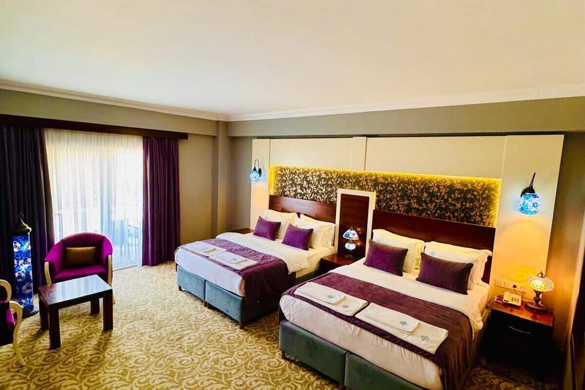 deluxe quadruple room, 1 bedroom, non smoking | premium bedding, minibar, in-room safe, individually decorated