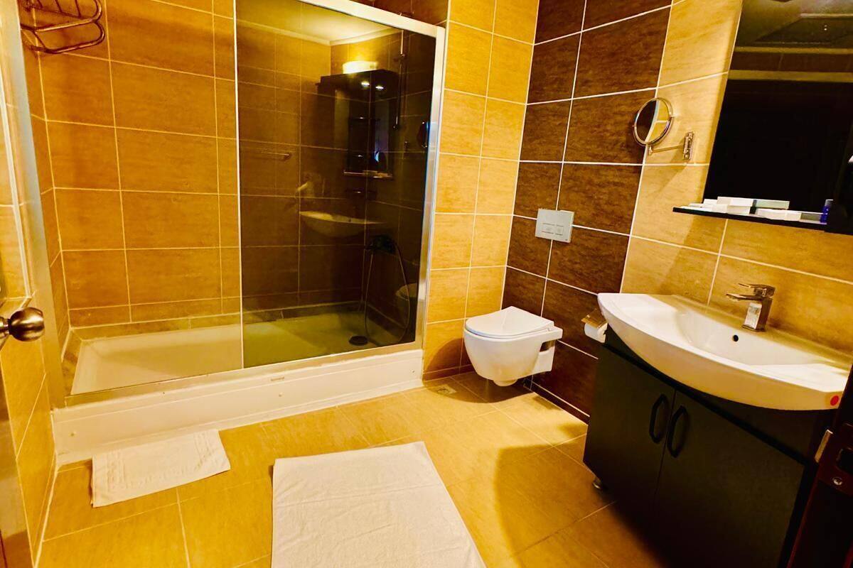 shower, hydromassage showerhead, designer toiletries, hair dryer