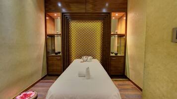 Relax in comfort with a long, narrow bed and cozy seating area.