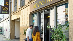 A hotel entrance with a sign reading "ADVA STAY" and a crown symbol above it. - AdvaStay by KING's (Munich)