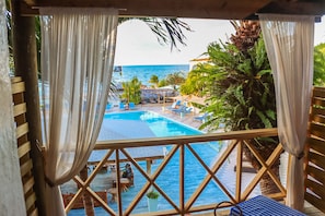 Partial Ocean View Cabana | Minibar, in-room safe, individually decorated, desk - Ocean Point Beach Resort & Spa - Adults Only (St. John's)