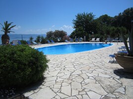 Outdoor pool, pool umbrellas, sun loungers