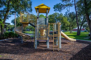 Explore the central tower and spiral slide at this park playground.