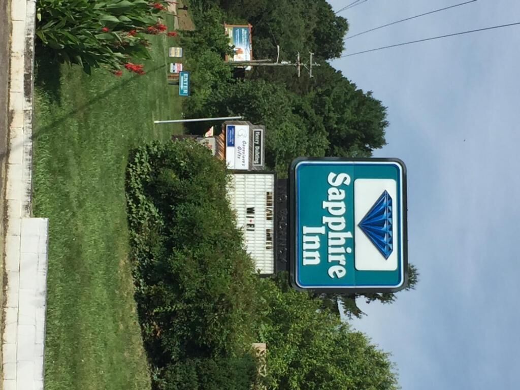 A Sapphire Inn sign with a blue diamond logo.