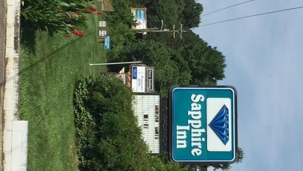 A Sapphire Inn sign with a blue diamond logo. - Sapphire Inn (Franklin)