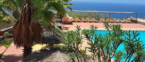 Outdoor pool, pool umbrellas, pool loungers