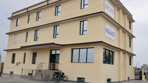 A multi-story building with a sign reading "AICON PALACE". - Hotel Aicon Palace (Agra)