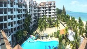 A resort with multiple-story buildings, a swimming pool, and a beach. - Bayu Beach Resort (Port Dickson)