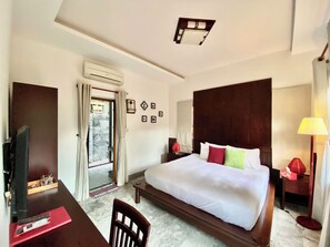 Family Room | Minibar, in-room safe, individually decorated, individually furnished - Villa Orchid Garden Riverside Hoi An (Da Nang)
