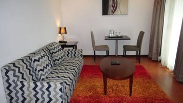 Suite, 1 Bedroom | Living room | LED TV